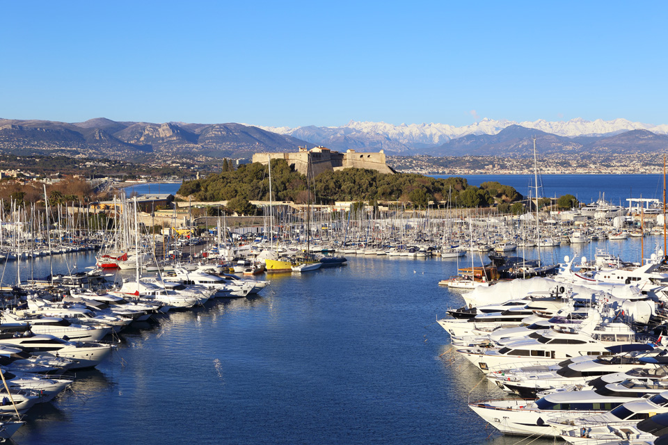 French Riviera: winter evening in the resort of Antibes. View of port, yachts and fortress
