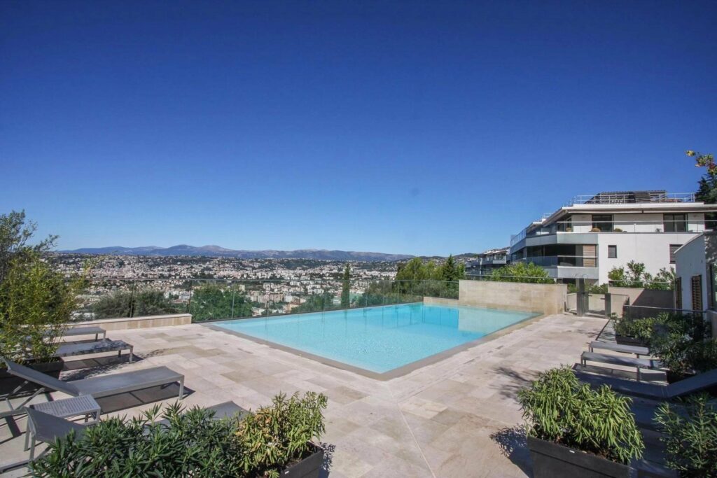infinity pool at penthouse for sale in south france with city view
