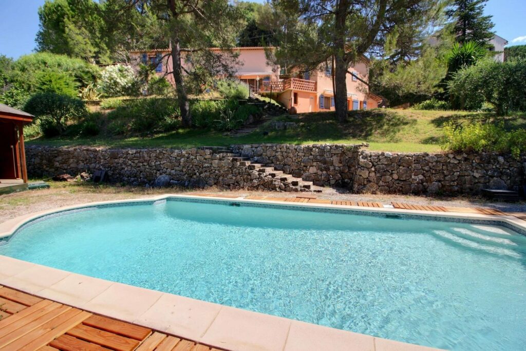 backyard pool of large villa in biot for sale