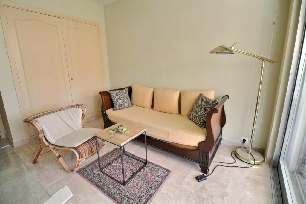 corner of living room with pale yellow couch in cannes basse californie apartment