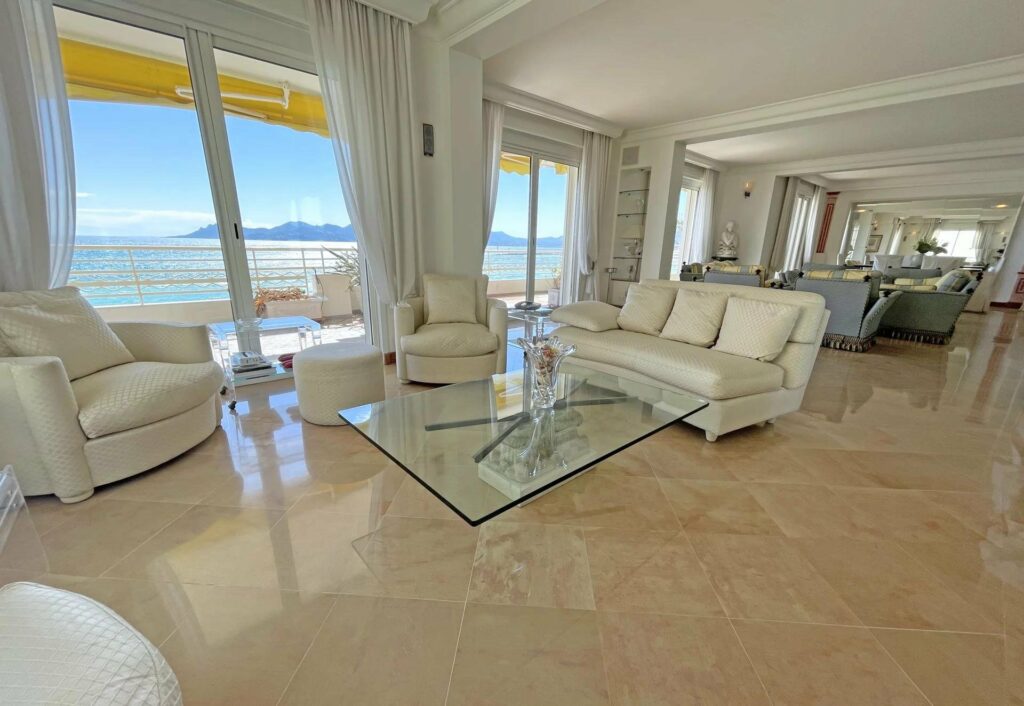 seating area in cannes luxury apartment with white chairs