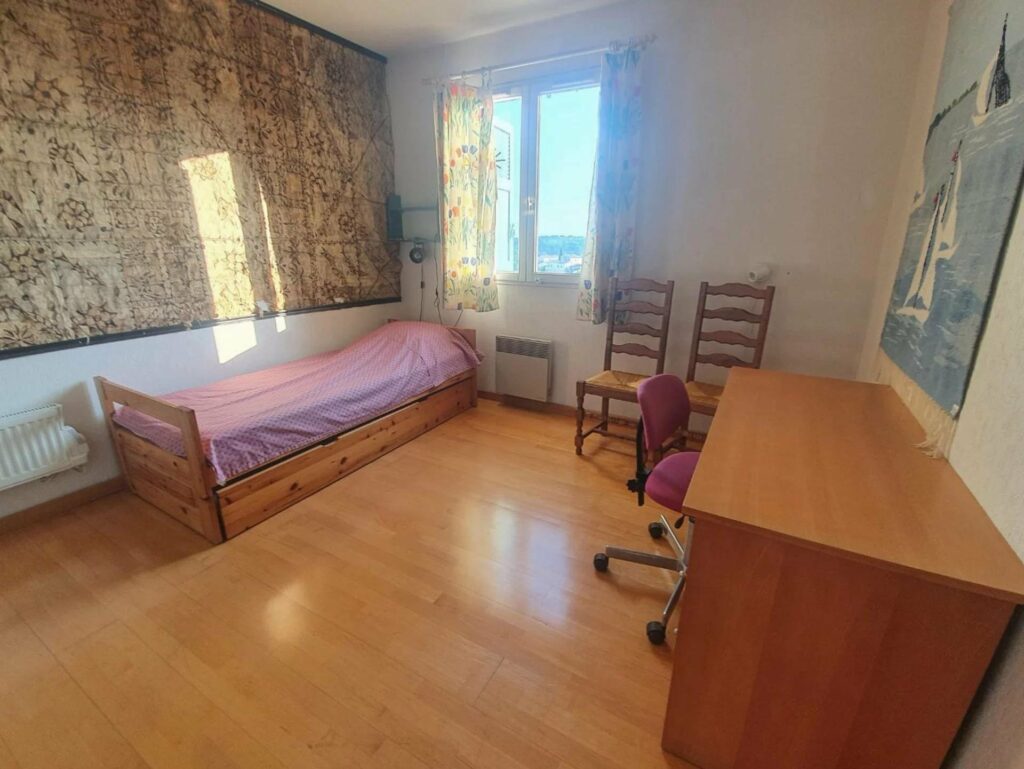 bedroom of house in nice for sale with wood floors