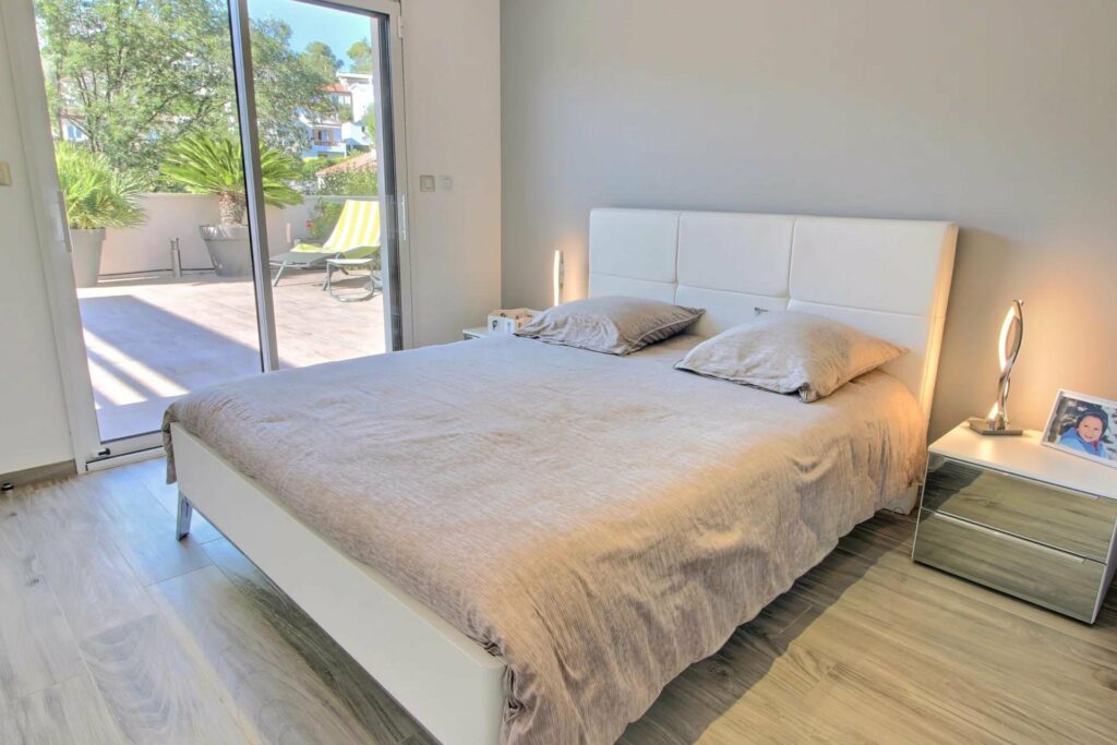 bedroom with white queen size bed in south france