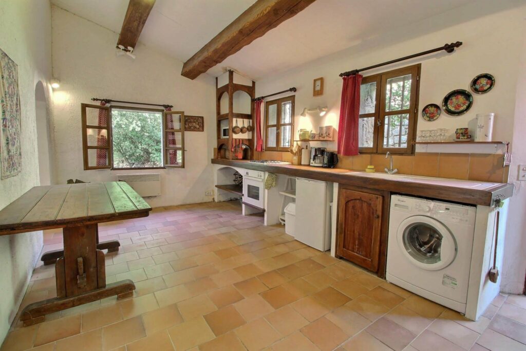 provencal kitchen with tile floors of seillan stone house