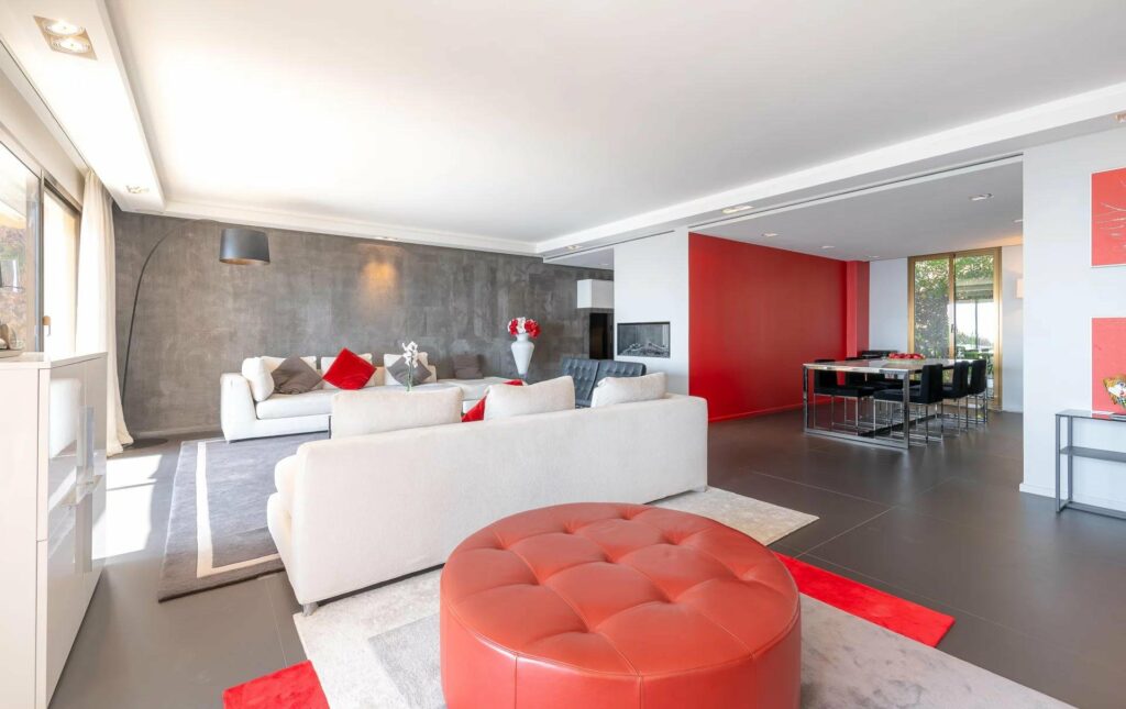modern living room with white couch and red leather