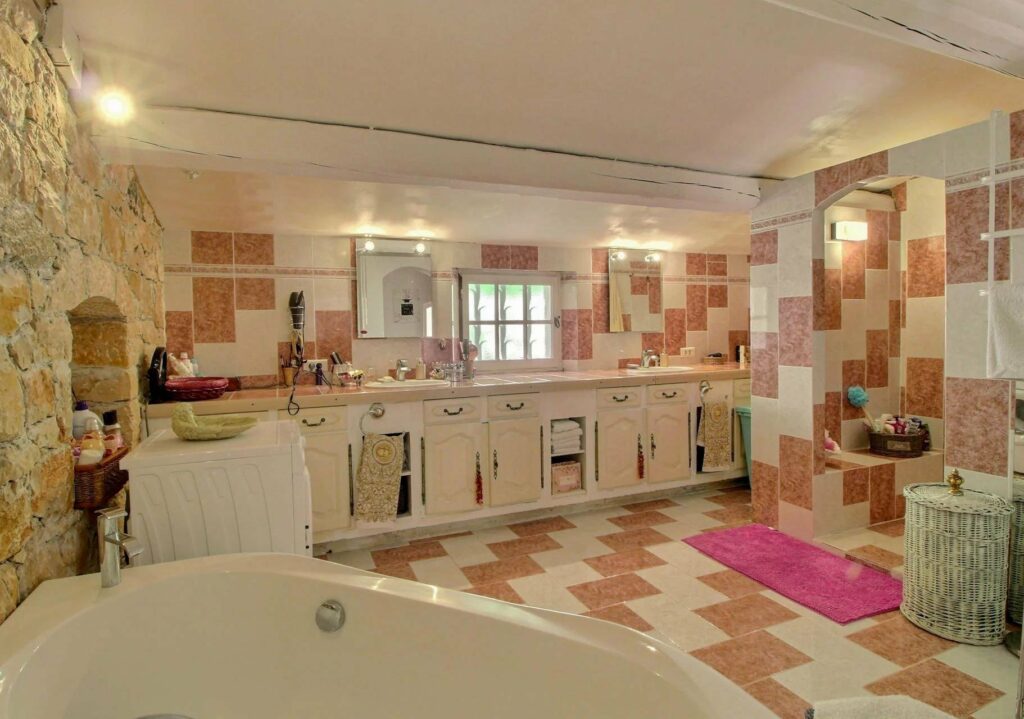 bathroom with checkered tile floor and wall