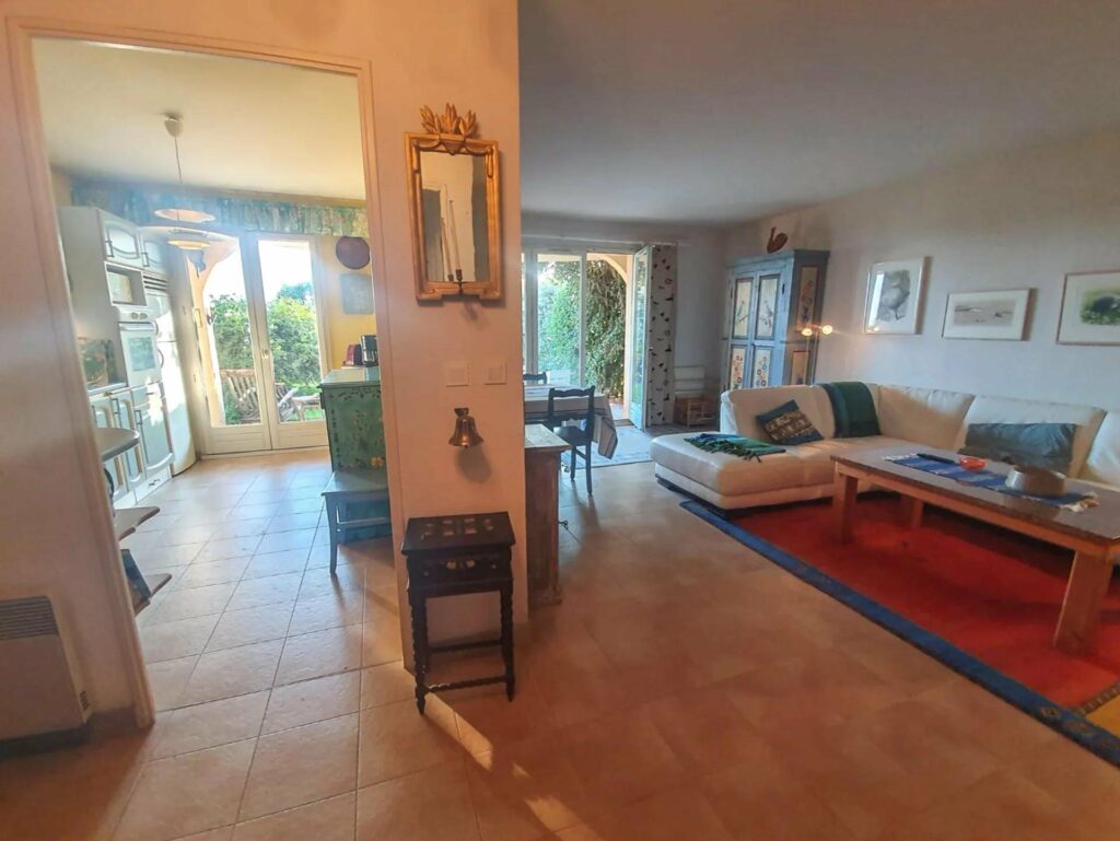 open interior of charming house in nice for sale with stone tile floors and access to garden