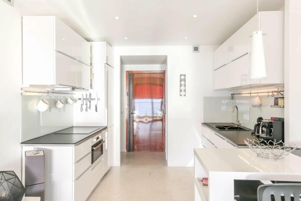 kitchen with white cabinets in menton apartment