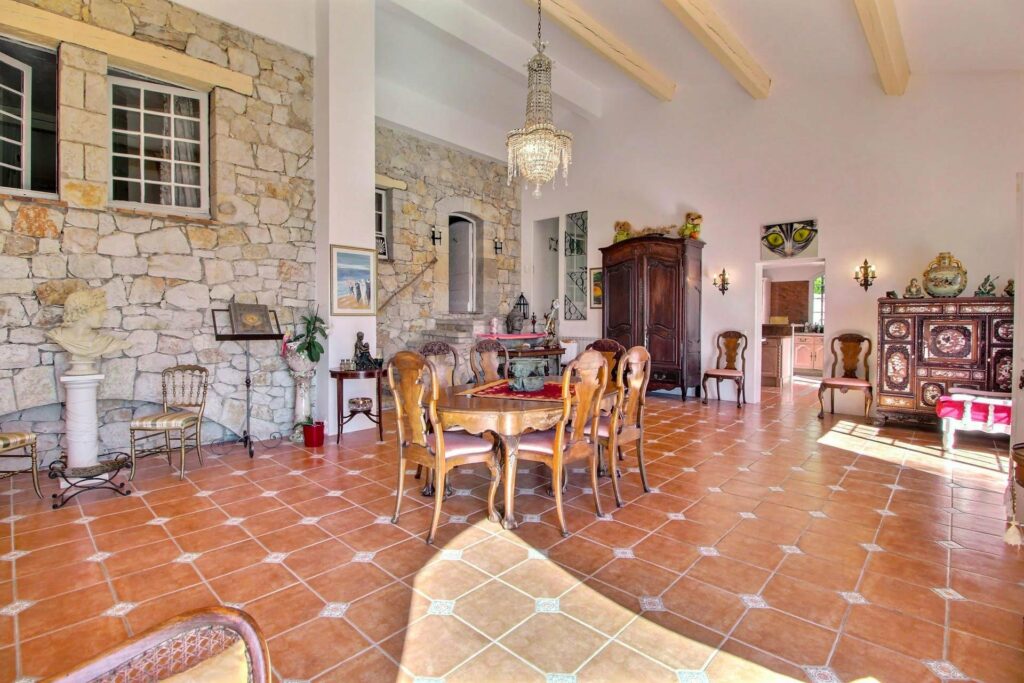 dining room in south france villa with brown tile floors