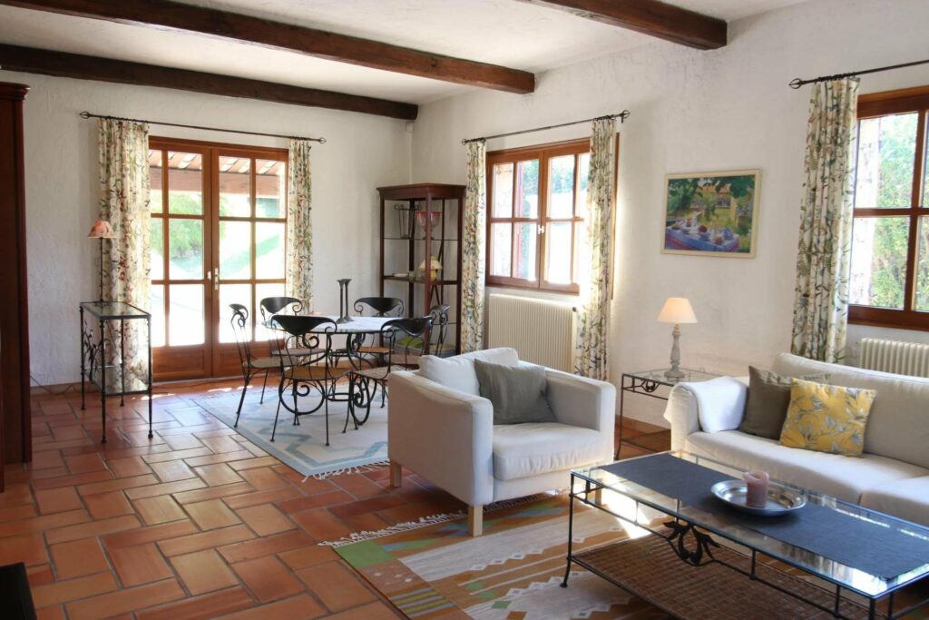 living room with provencal design and view of large garden