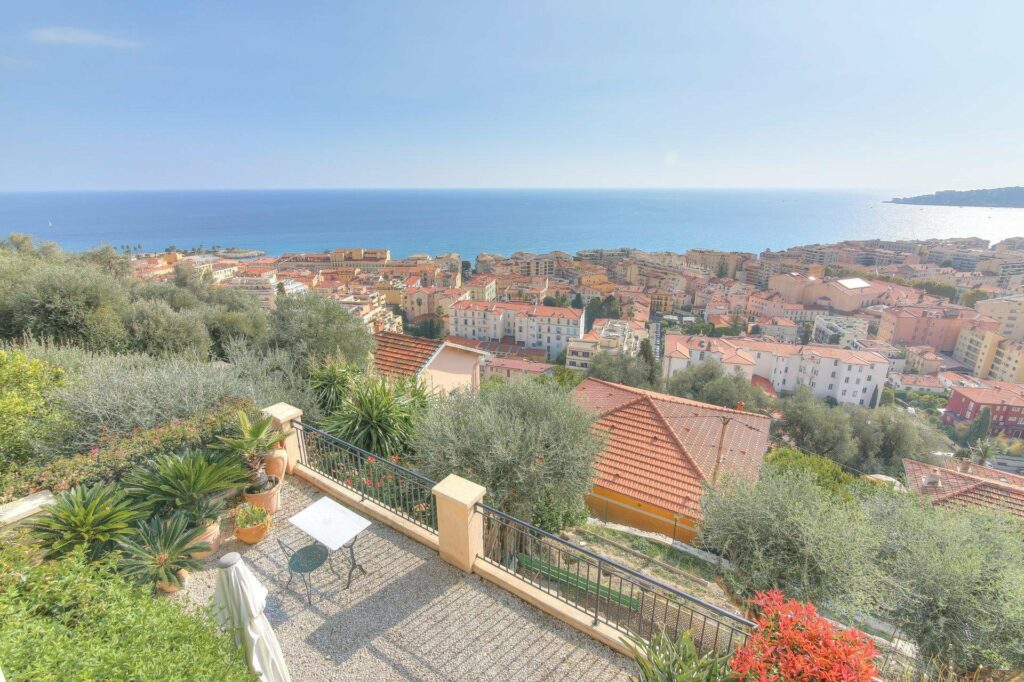 garden of property in menton with plants and gravel overlooking riviera