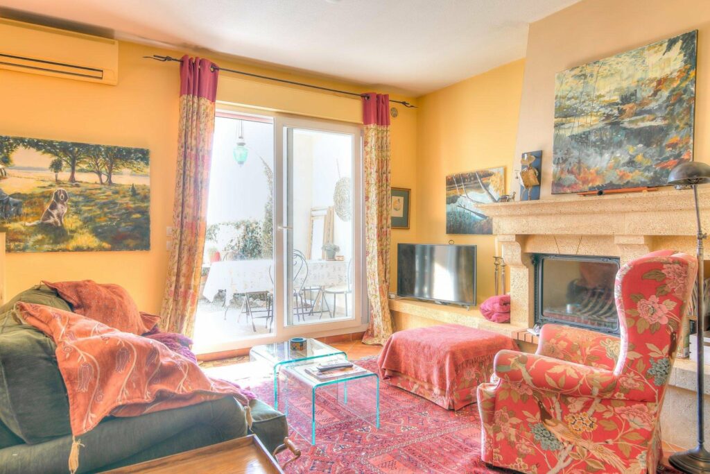 charming red interior of living room in menton house for sale