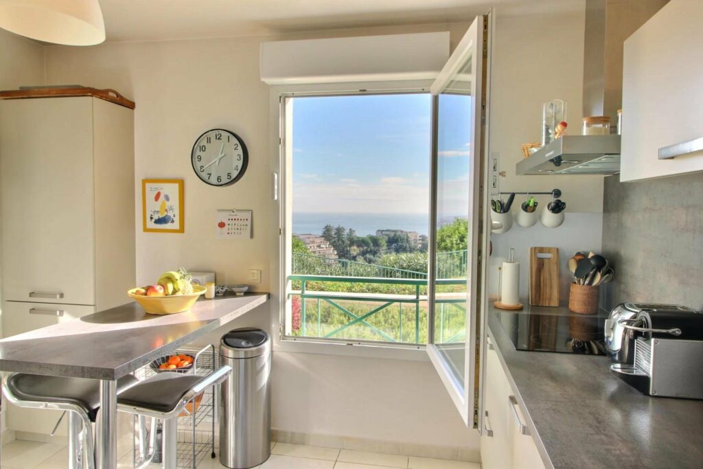 mountain view through window in modern kitchen