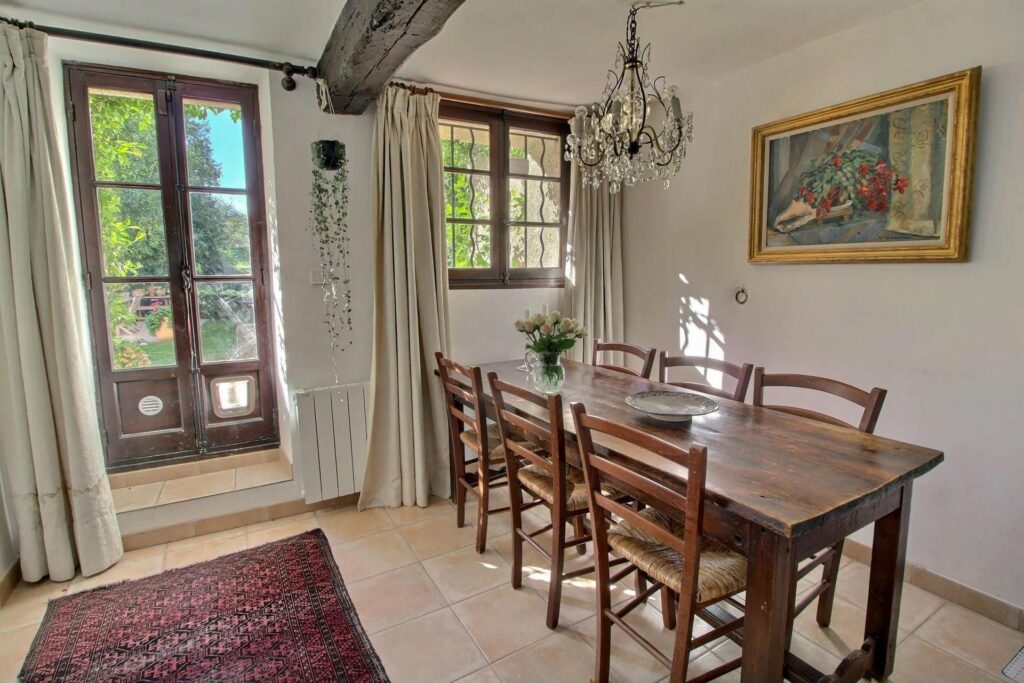 interior of village house with wood table and exposed wooden beams