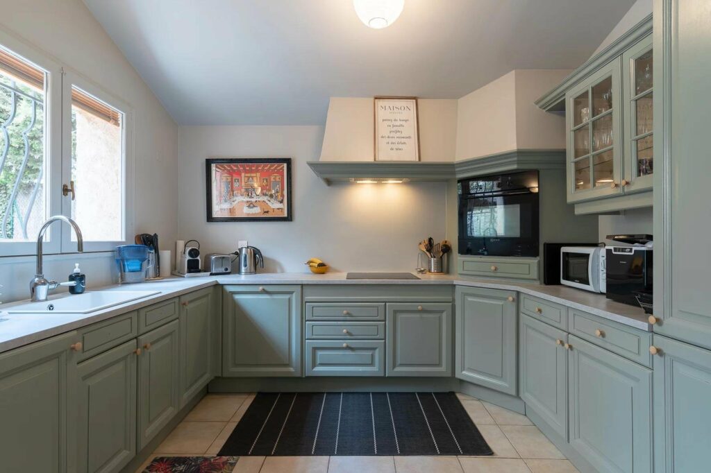 kitchen with blue cabinet and white tile floors