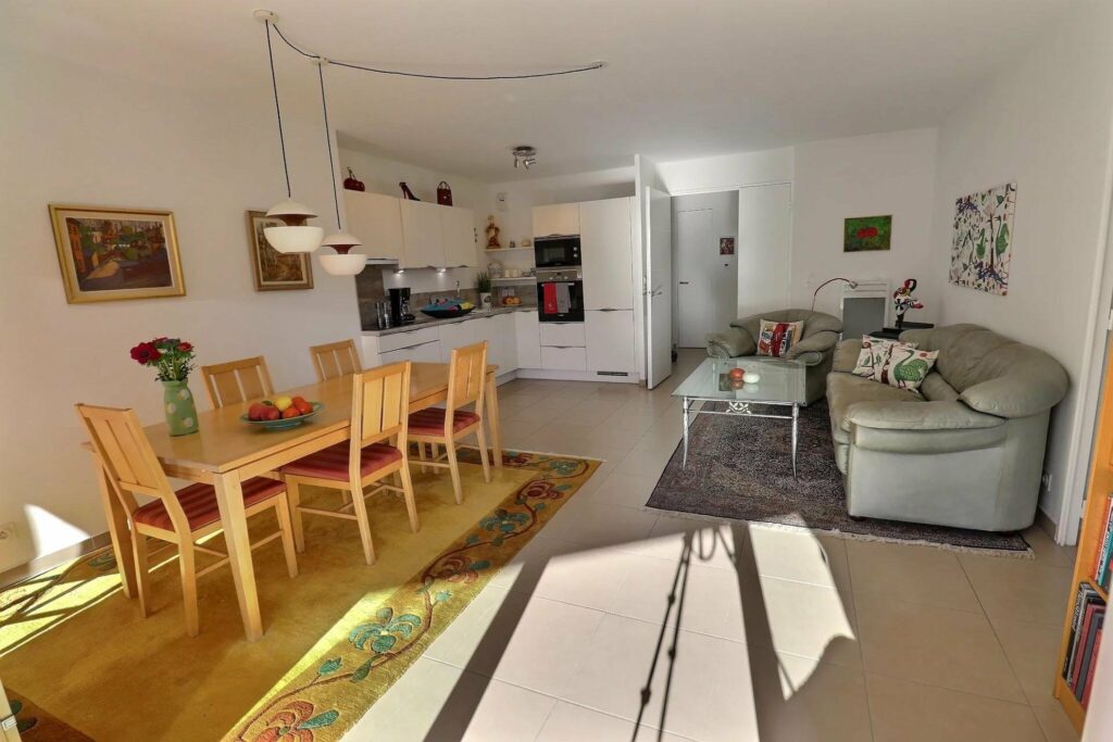 view of living room, dining room and kitchen of apartment in saint raphael