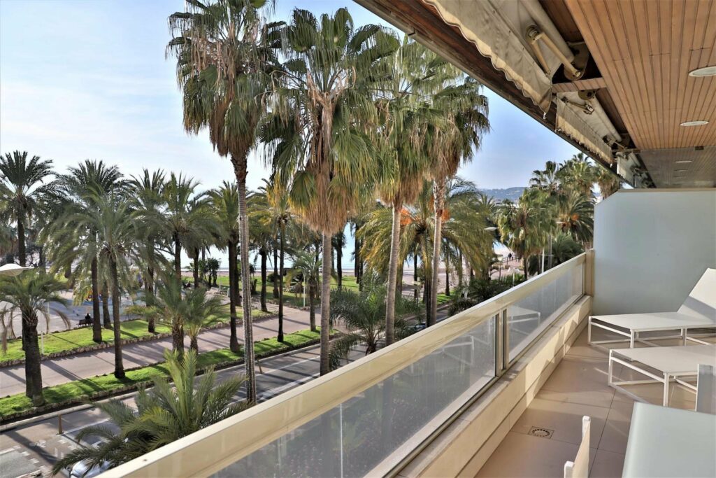 terrace with view of beach in cannes apartment on the croisette