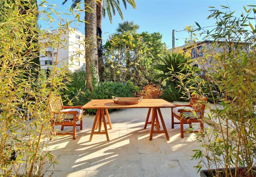 backyard of home for sale in cannes with large table