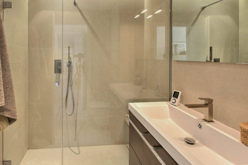 bathroom with large double sink and large standing shower
