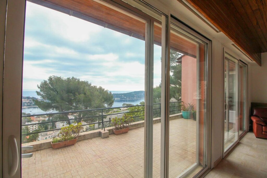 glass sliding doors access to terrace with view of the french riviera