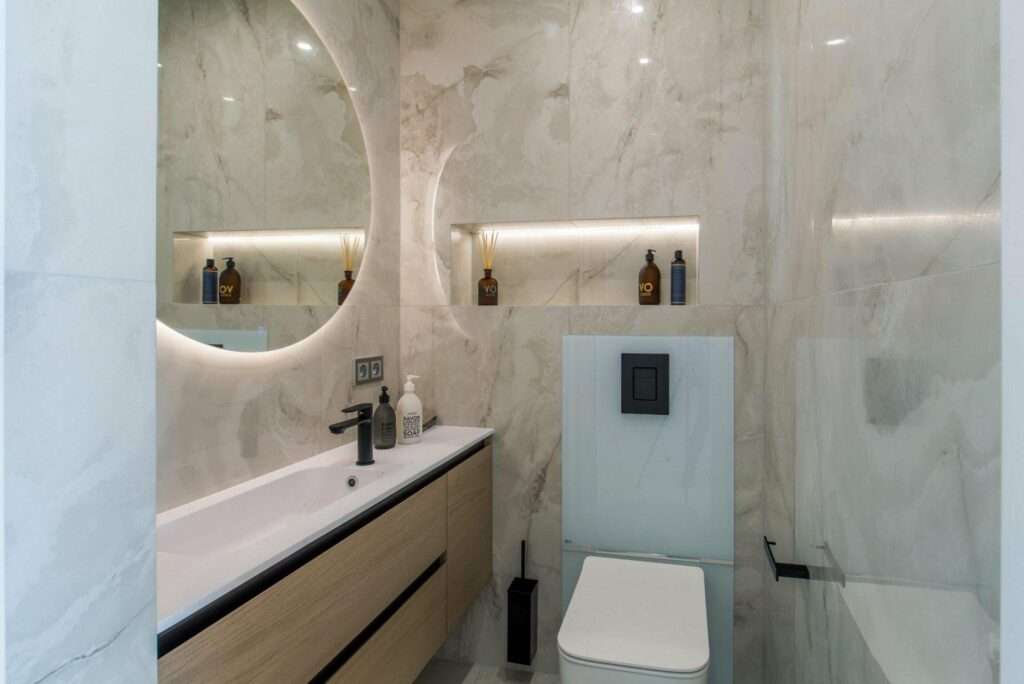 bathroom with white marble tiling and standing shower