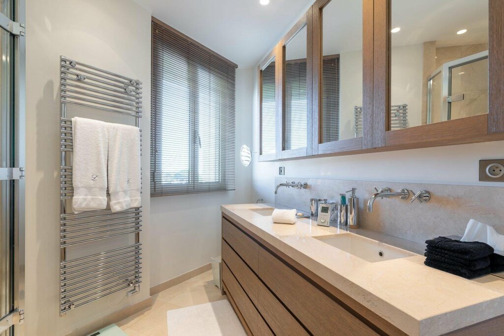 bathroom with beige double sink and