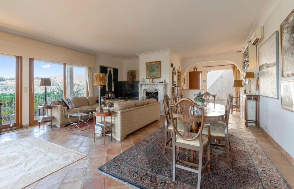 interior of villa in cagnes-sur-mer with terracotta tile floors and beige couch