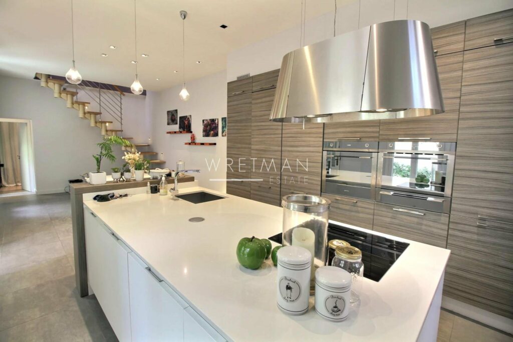 kitchen with grey wooden cabinets and white marble island