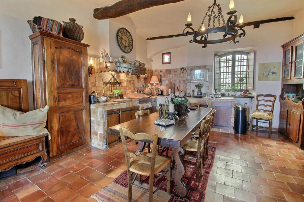 kitchen with classic european design and long wooden dining table