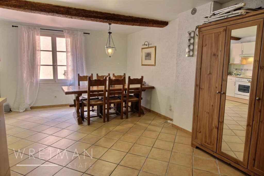 dining room with wooden dining table with beige tile floors