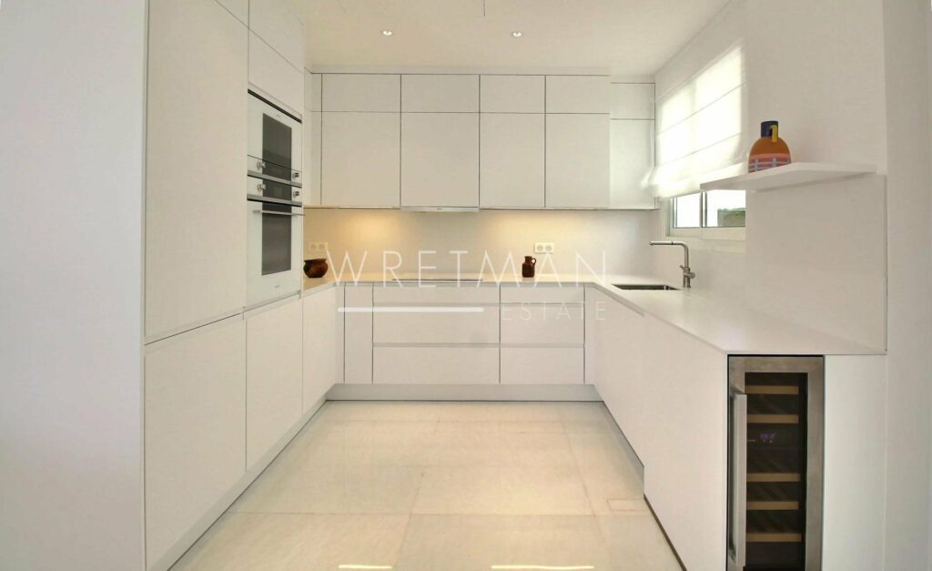 kitchen with all white modern design and white cabinets