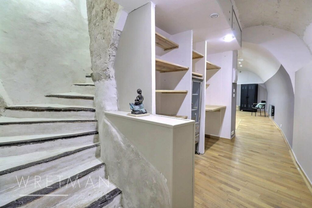 white wooden stairway leading to upstairs bedrooms