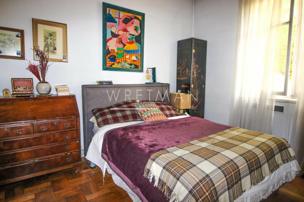 bedroom with queen size bed with red plaid bedding