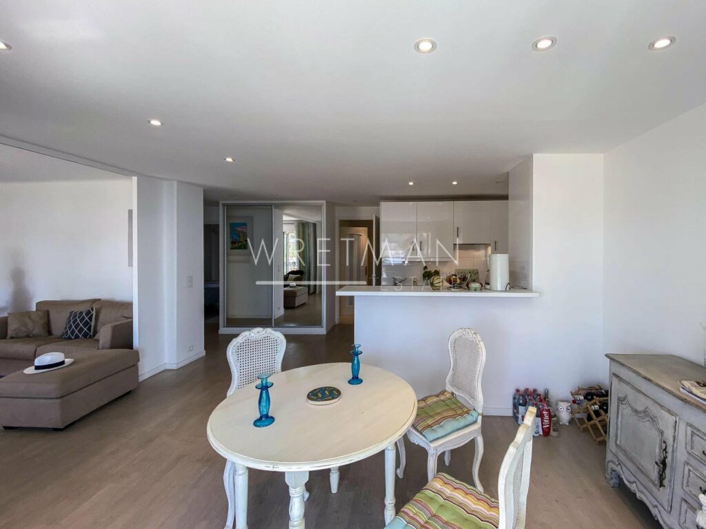 sea view apartment for sale in antibes with white round wooden dining table