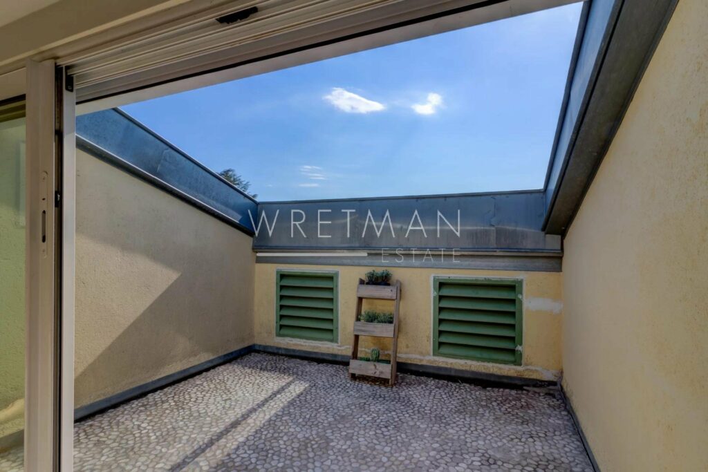 enclosed bedroom terrace with large skylight