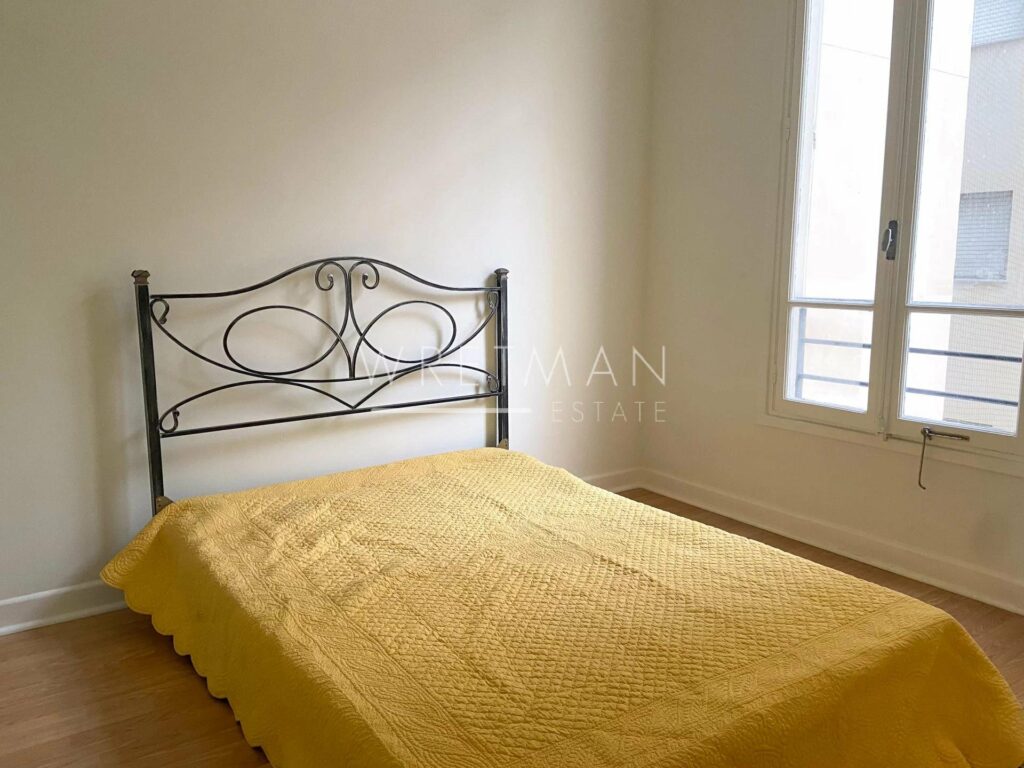 bedroom with queen size bed and yellow bedding