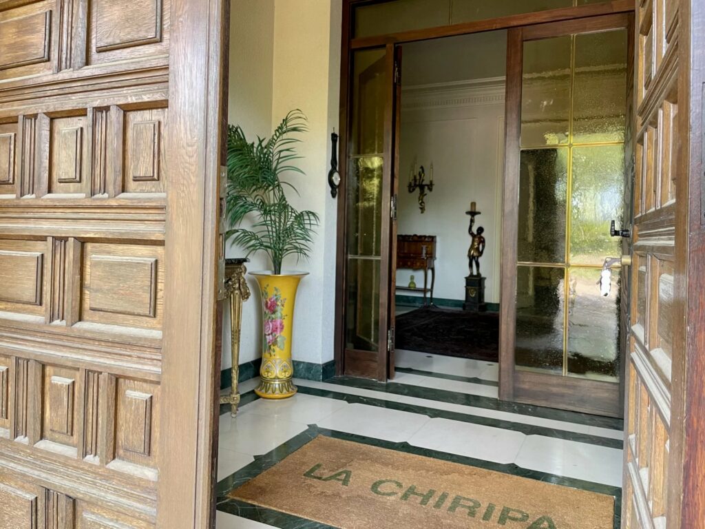 grand entrance to villa with large wooden door
