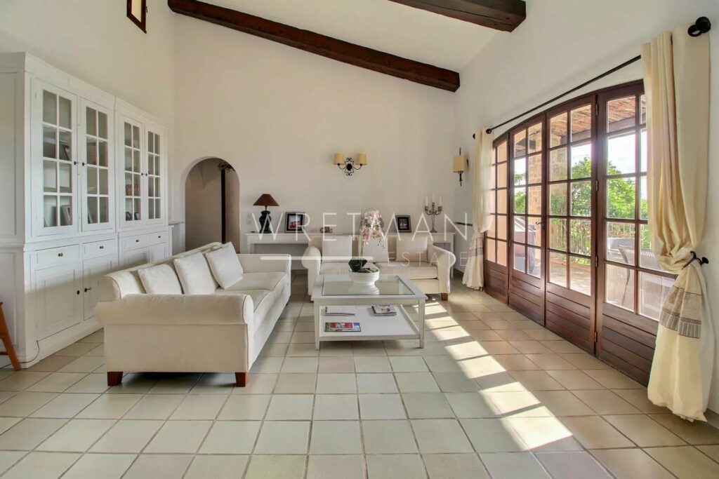 living room with white tile floors and white couch