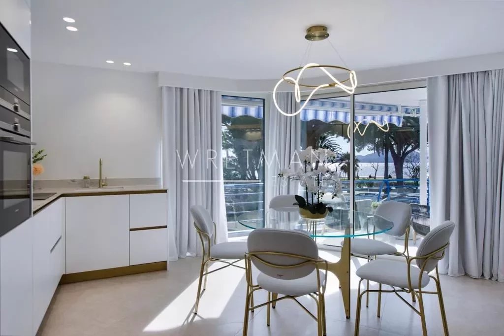 dining area with sea view and hanging light fixture