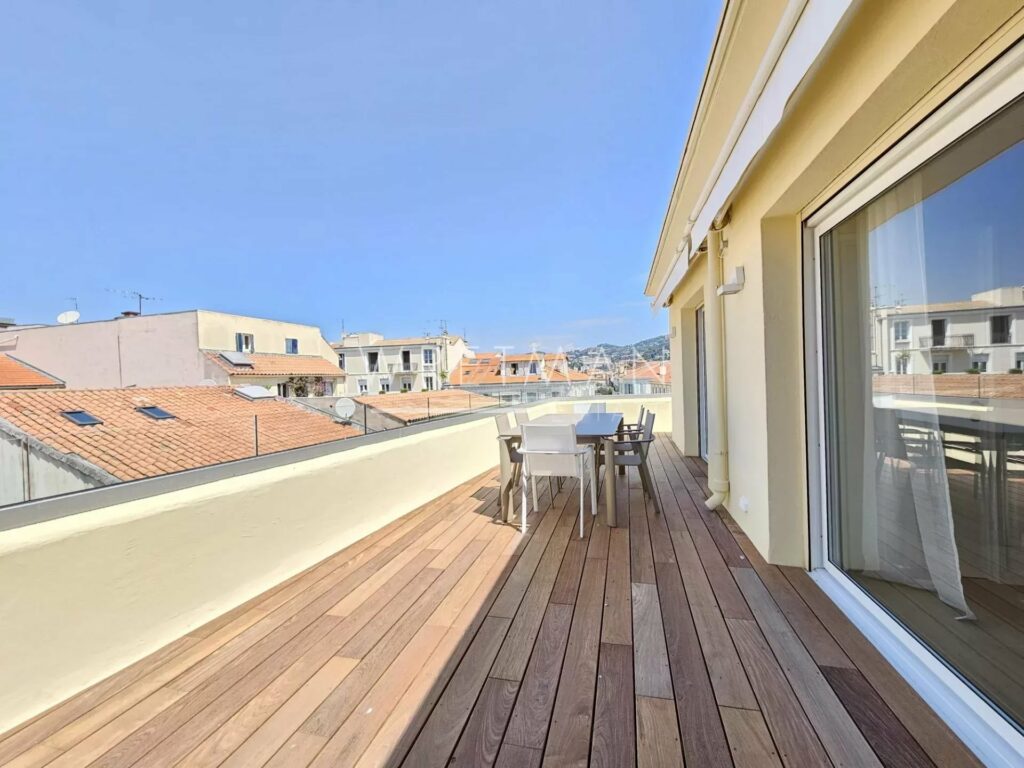 open terrace with view of city and wooden floors